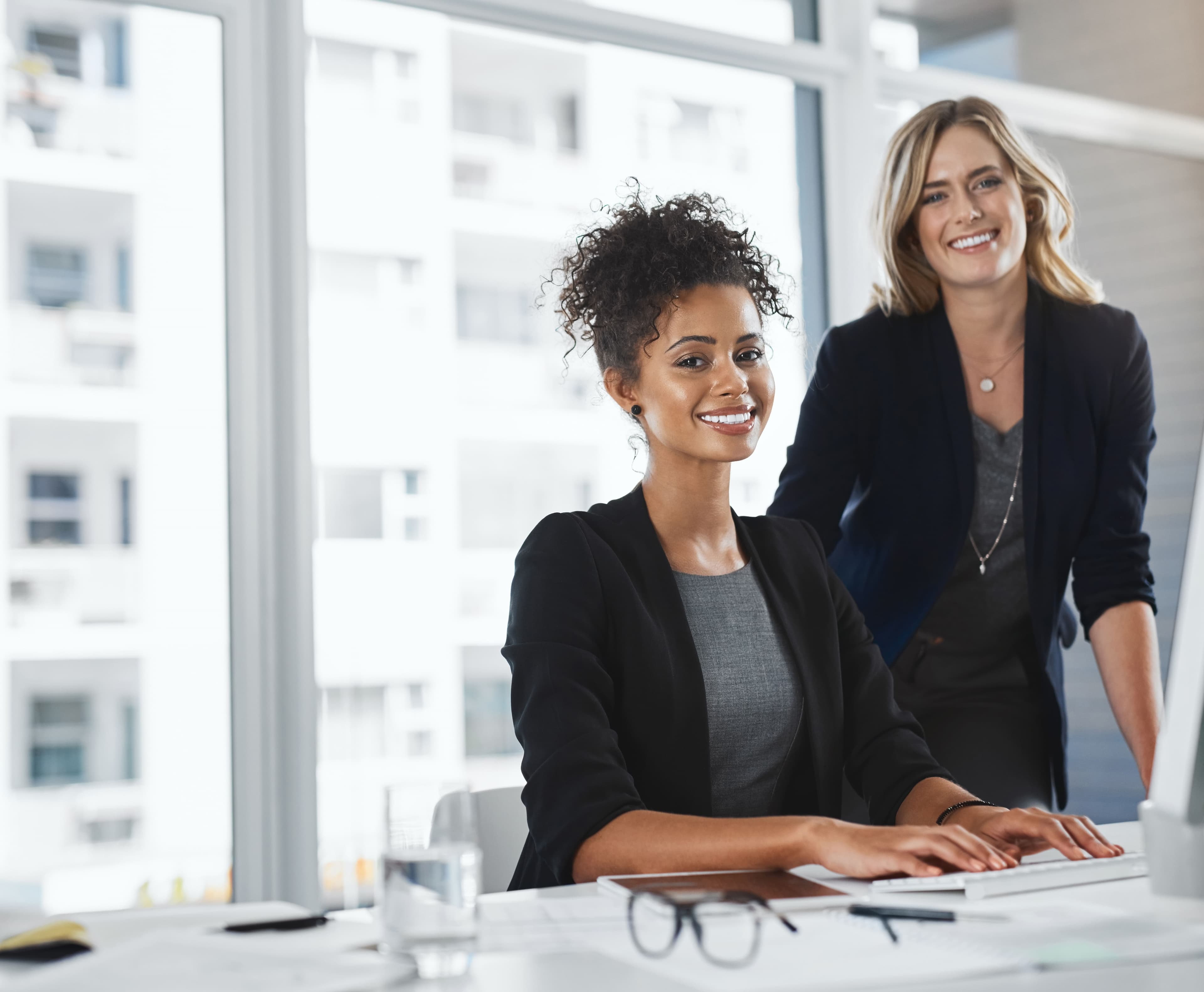 two women in an office environment